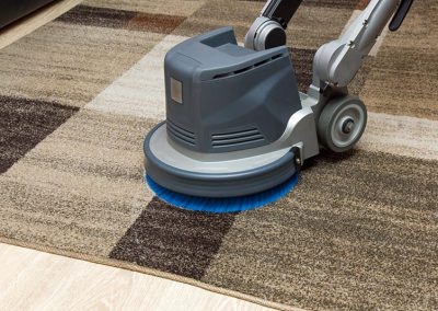 Carpets chemical cleaning with professionally disk machine. Early spring cleaning.