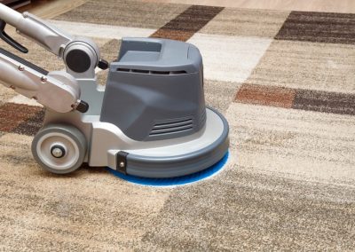 Carpets chemical cleaning with professionally disk machine. Early spring cleaning.